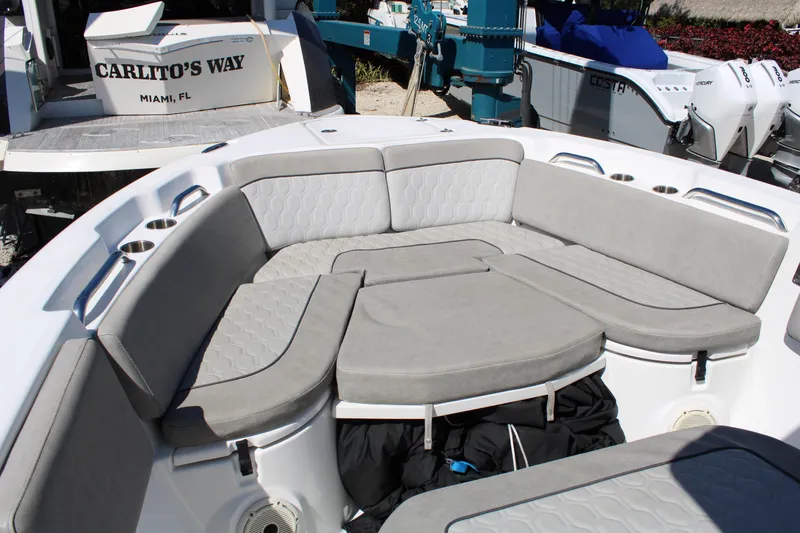 Slide: The Image of 2021 Sea Fox 268 Commander boat with cushioned seating area and cup holders. - 24