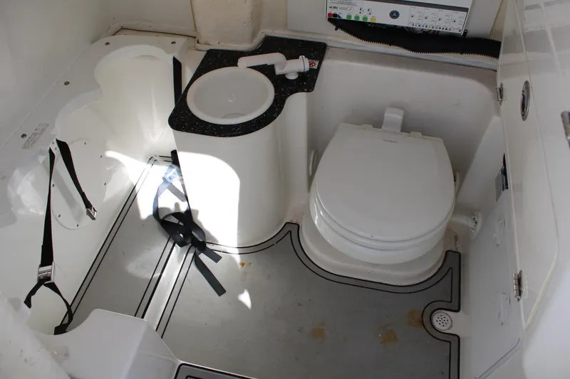Slide: The Image of 2021 Sea Fox 268 Commander boat bathroom with toilet and sink. - 30