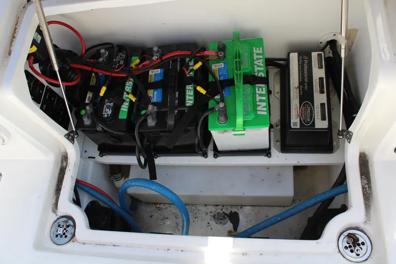 Slide: The Image of Battery compartment of a 2021 Sea Fox 268 Commander boat, featuring multiple Interstate batteries. - 36