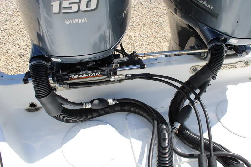 Slide: The Image of Twin Yamaha 150 engines on a 2021 Sea Fox 268 Commander boat, featuring SeaStar hydraulic steering. - 7