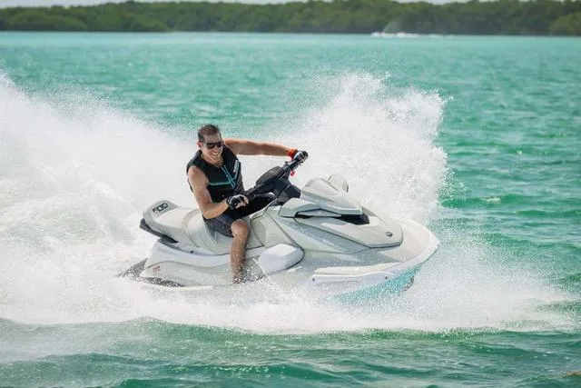 Slide: The Image of 2025 Yamaha Waverunner VX Cruiser HO with Audio speeding on turquoise water. - 17