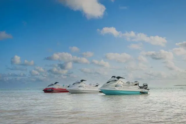 Slide: The Image of 2025 Yamaha Waverunner VX Cruiser HO with Audio on calm water under blue sky. - 20