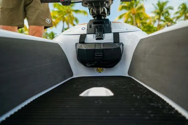 Slide: The Image of 2025 Yamaha Waverunners Superjet, close-up view, tropical background with palm trees. - 15