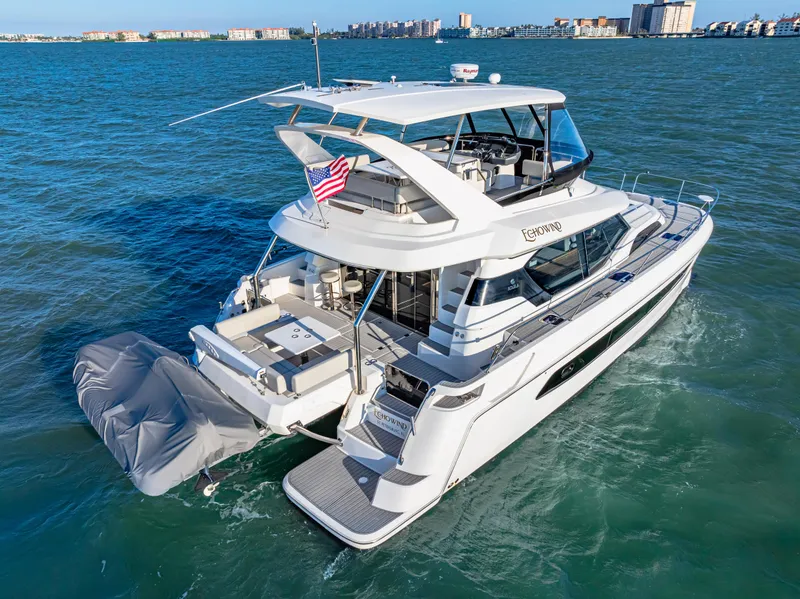 Slide: The Image of Aquila 44 Yacht 2022 cruising on blue waters, showcasing luxury and modern design. - 11