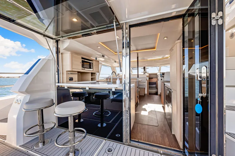 Slide: The Image of Luxurious interior of 2022 Aquila 44 Yacht with modern design and spacious seating. - 19