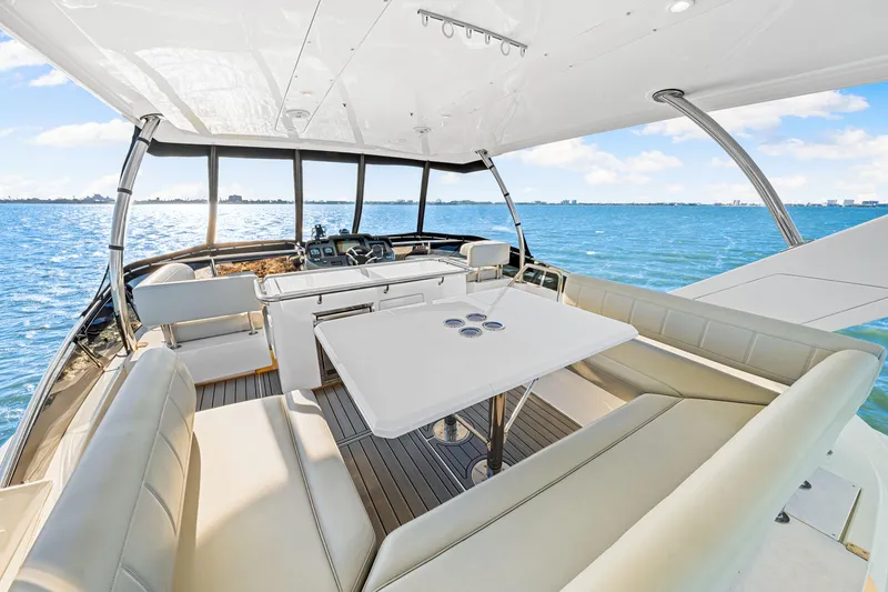 Slide: The Image of Luxurious 2022 Aquila 44 Yacht interior with spacious seating and ocean view. - 25