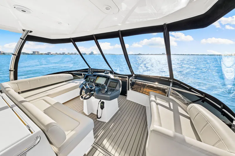Slide: The Image of Interior of 2022 Aquila 44 Yacht with panoramic ocean view and modern helm. - 26