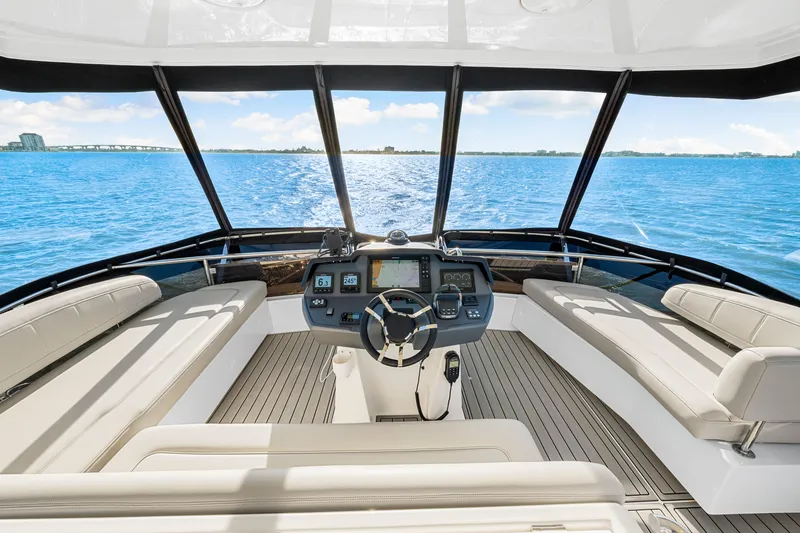 Slide: The Image of Aquila 44 Yacht 2022 helm with panoramic ocean view and luxurious seating. - 27