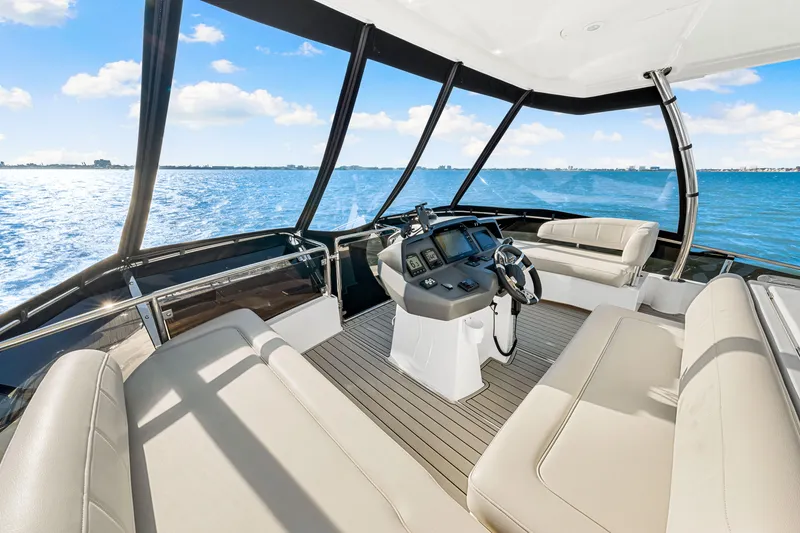 Slide: The Image of Interior view of 2022 Aquila 44 Yacht with luxurious seating and helm. - 28