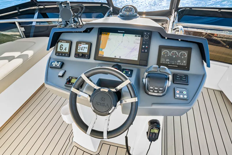 Slide: The Image of Cockpit of 2022 Aquila 44 Yacht with advanced navigation and control systems. - 29