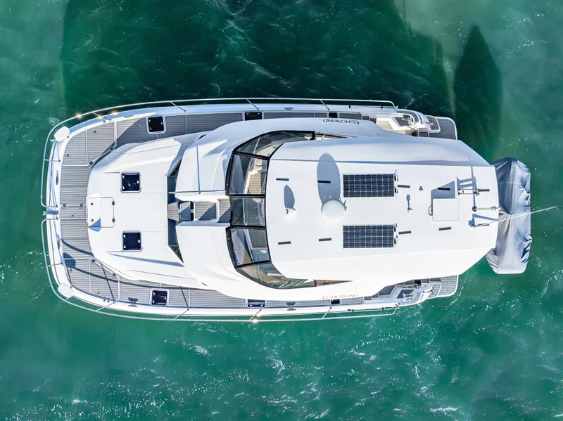 Slide: The Image of Aerial view of 2022 Aquila 44 Yacht on turquoise water. - 3