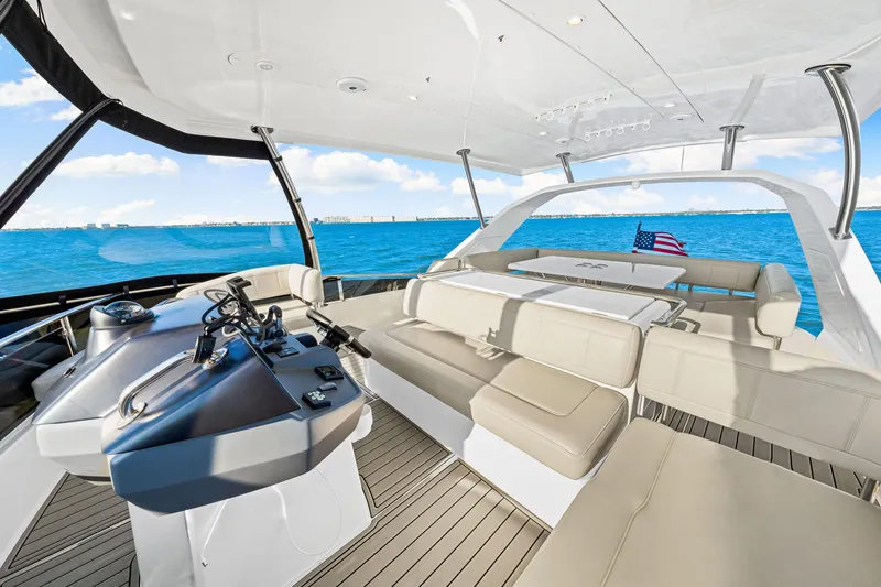 Slide: The Image of Luxurious 2022 Aquila 44 Yacht interior with spacious seating and ocean view. - 31