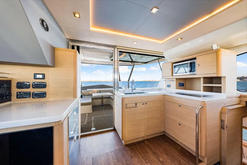 Slide: The Image of Interior of 2022 Aquila 44 Yacht with modern kitchen and ocean view. - 35