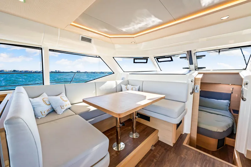 Slide: The Image of Luxurious interior of 2022 Aquila 44 Yacht with elegant seating and panoramic windows. - 38
