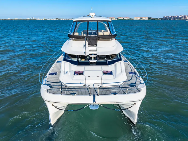 Slide: The Image of Aquila 44 Yacht 2022 cruising on open water, front view. - 4