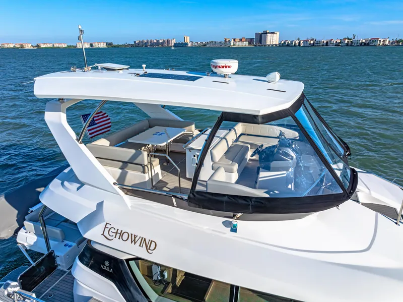 Slide: The Image of Aquila 44 Yacht 2022 on water, featuring spacious deck and modern design. - 6