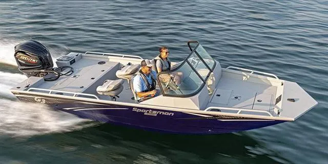 Slide: The Image of 2025 G3 Sportsman 2100 boat cruising on water with two passengers. - 11