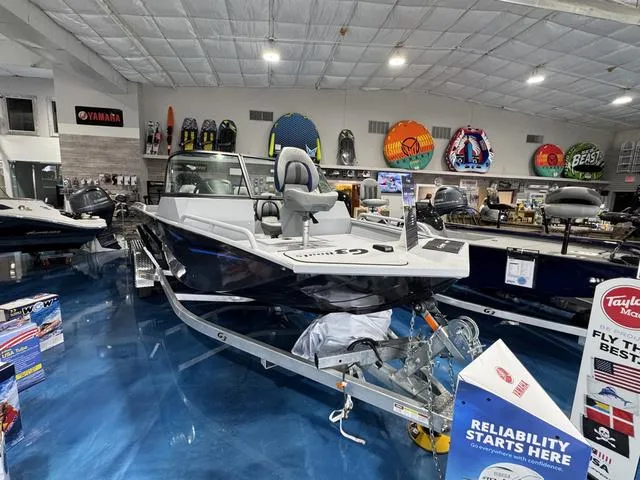 Slide: The Image of 2025 G3 Sportsman 2100 boat displayed in showroom with vibrant accessories. - 3