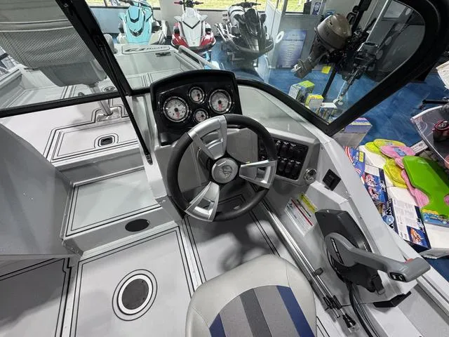 Slide: The Image of 2025 G3 Sportsman 2100 boat interior with steering wheel and control panel. - 8