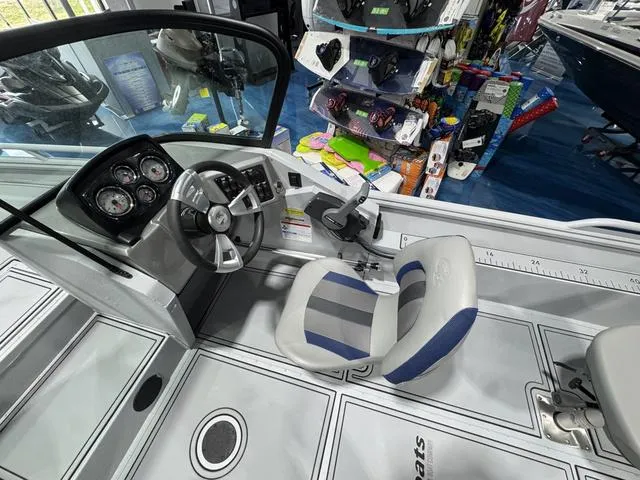 Slide: The Image of 2025 G3 Sportsman 2100 boat interior with steering wheel and dashboard controls. - 9