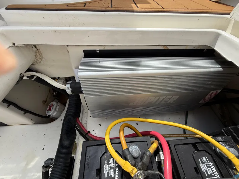 Slide: The Image of 2010 Fountain 38 LX boat battery compartment with wiring and inverter. - 10