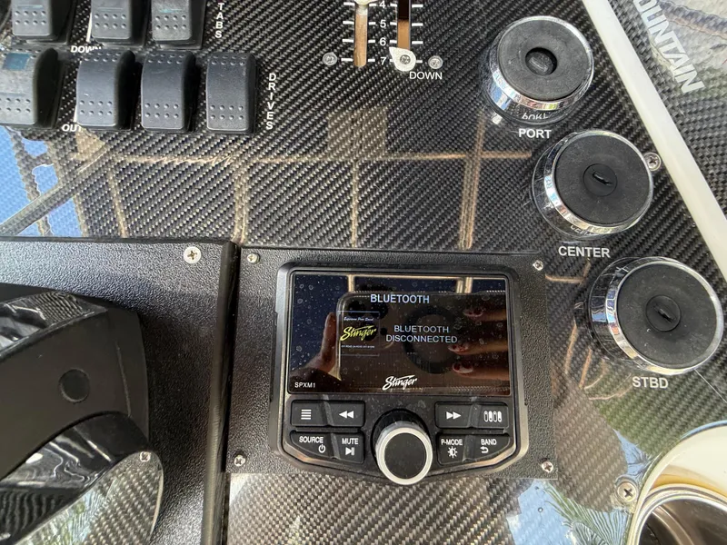 Slide: The Image of Control panel of a 2010 Fountain 38 LX boat with Bluetooth display. - 19