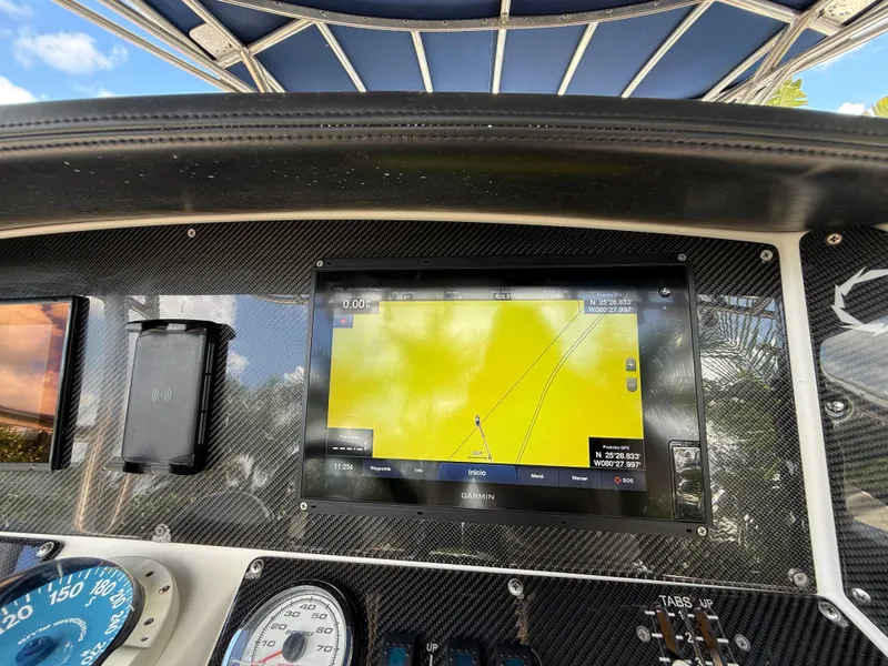 Slide: The Image of Dashboard of 2010 Fountain 38 LX boat with navigation display and gauges. - 20