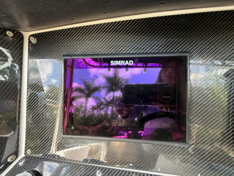 Slide: The Image of Simrad display on 2010 Fountain 38 LX boat with carbon fiber dashboard. - 21