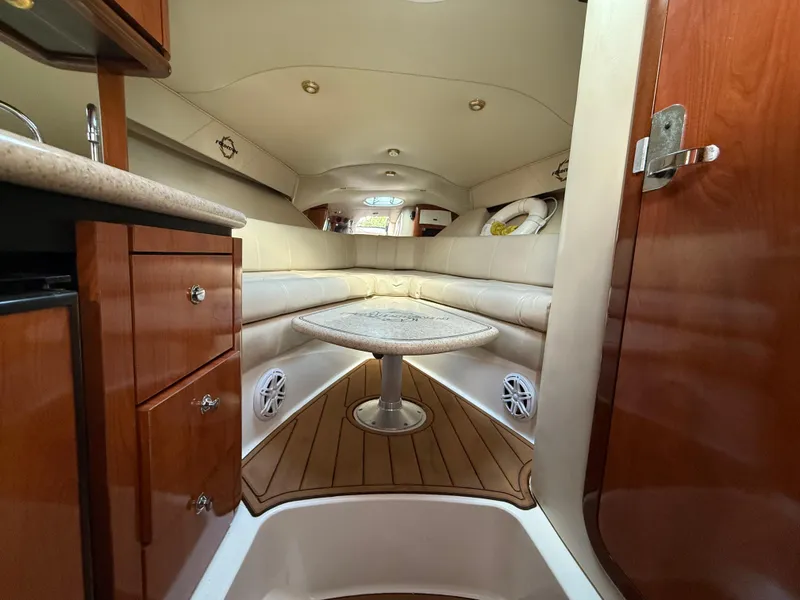 Slide: The Image of Luxurious interior of 2010 Fountain 38 LX boat with wood accents and cozy seating. - 32
