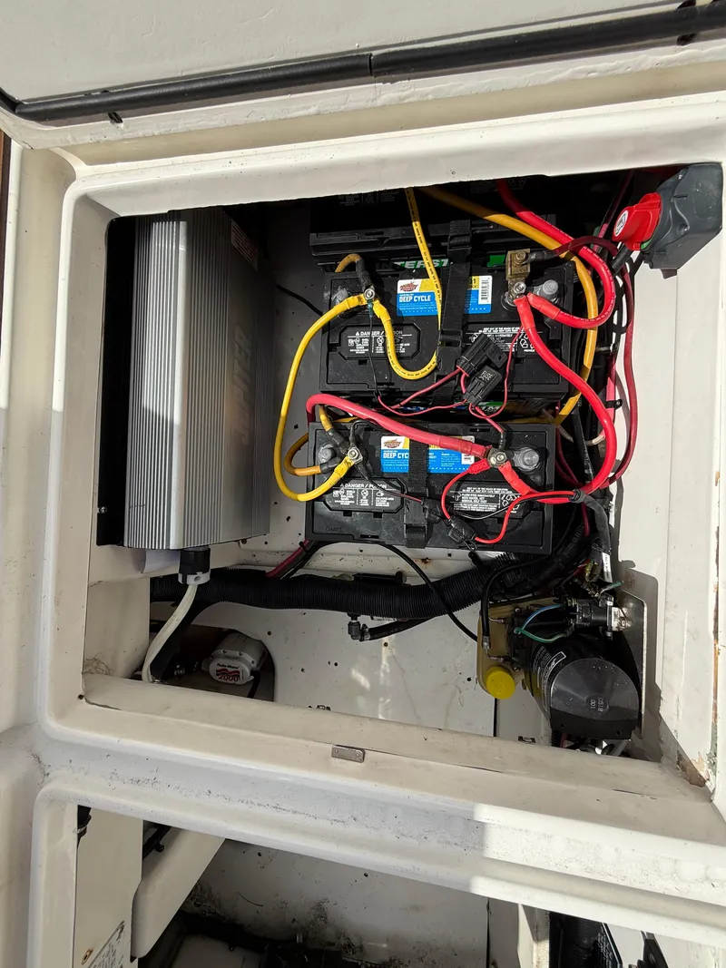 Slide: The Image of 2010 Fountain 38 LX boat battery compartment with wiring and components. - 7