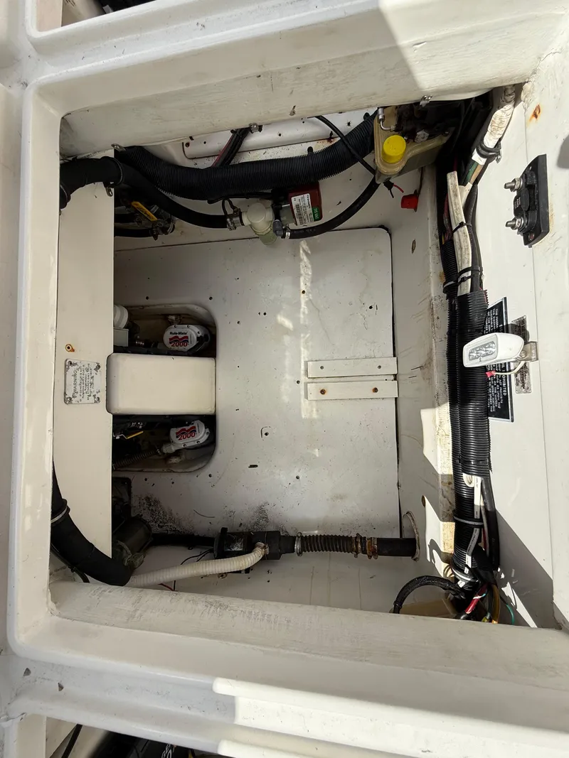 Slide: The Image of Engine compartment of a 2010 Fountain 38 LX boat, showing wiring and components. - 8