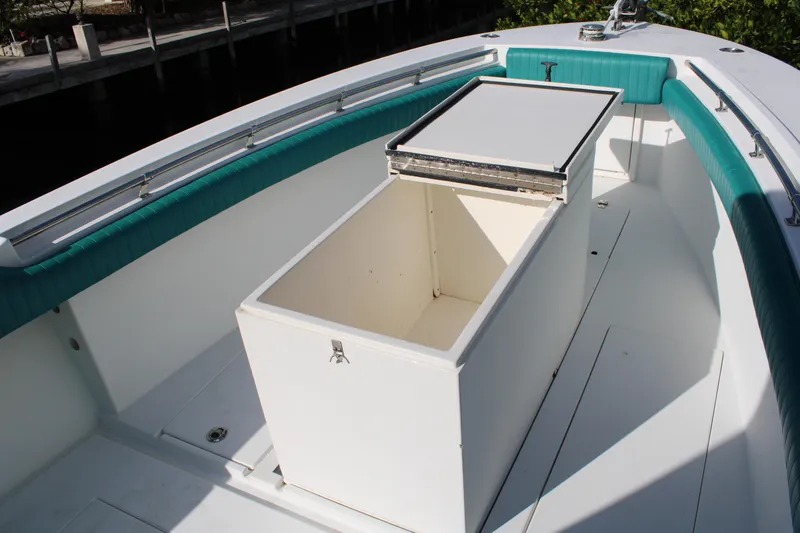 Slide: The Image of 1999 Whitewater 28 Center Console boat with open storage compartment. - 12