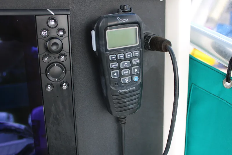 Slide: The Image of ICOM marine radio on a 1999 Whitewater 28 Center Console boat dashboard. - 20