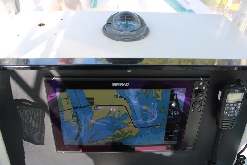 Slide: The Image of Simrad navigation system on 1999 Whitewater 28 Center Console boat dashboard. - 22