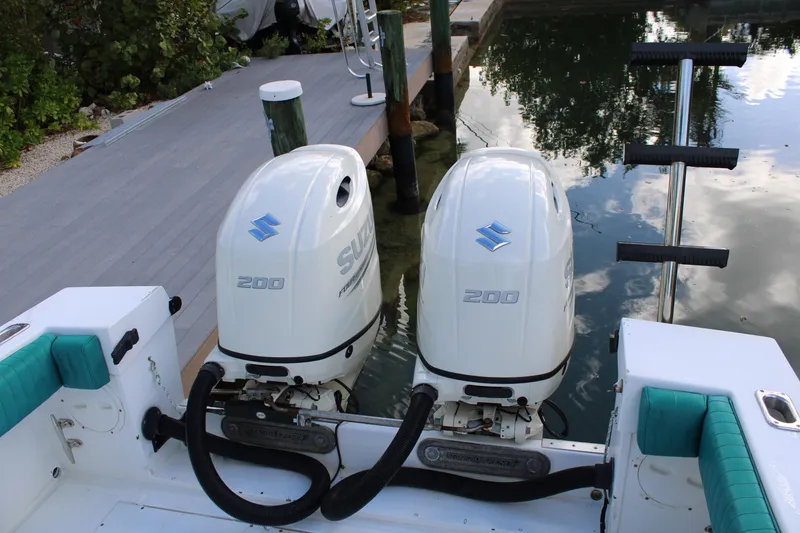 Slide: The Image of Twin Suzuki 200 outboard motors on a 1999 Whitewater 28 Center Console boat. - 24