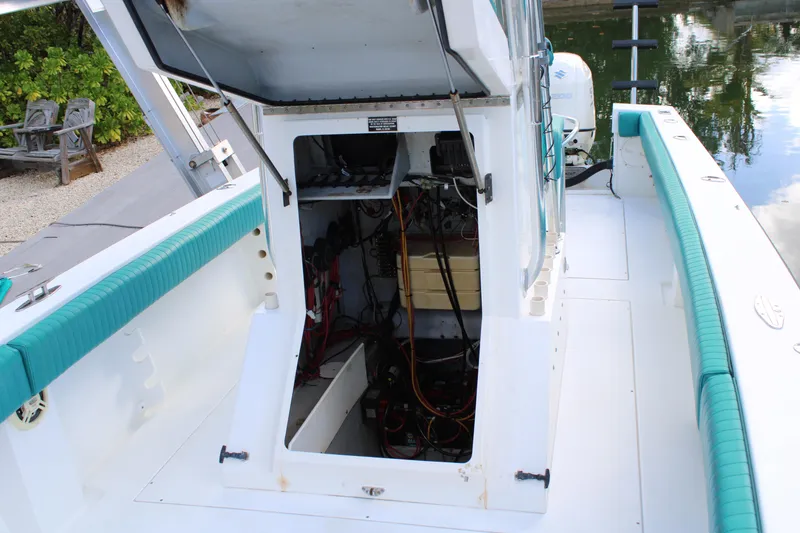 Slide: The Image of 1999 Whitewater 28 Center Console boat with open hatch, revealing interior components. - 31