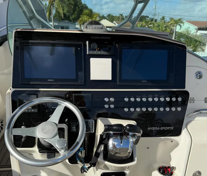 Slide: The Image of 2005 Hydra-Sports Vector 3300 VX helm with dual displays and steering wheel. - 12
