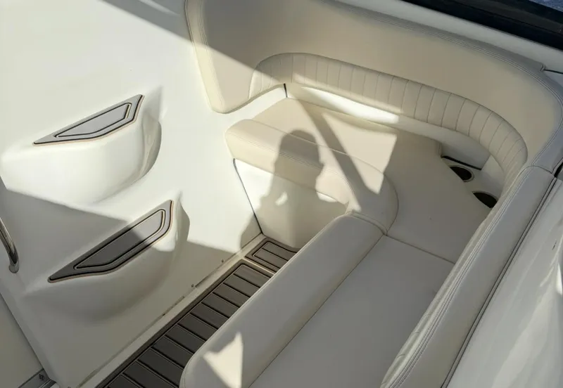 Slide: The Image of 2005 Hydra-Sports Vector 3300 VX interior with white seating and storage compartments. - 13