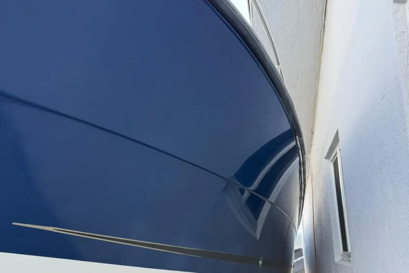 Slide: The Image of 2005 Hydra-Sports Vector 3300 VX boat hull, blue finish, close-up view. - 21