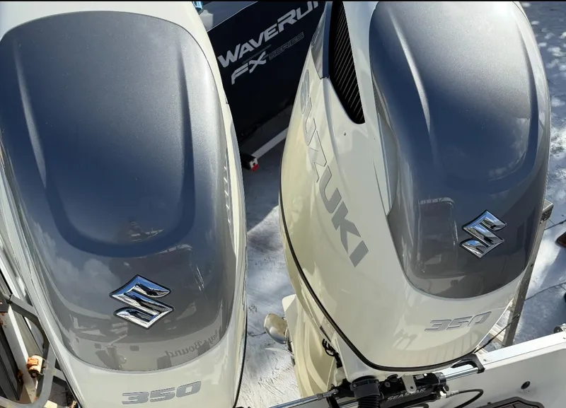 Slide: The Image of Twin Suzuki 350 outboard engines on a 2005 Hydra-Sports Vector 3300 VX boat. - 3