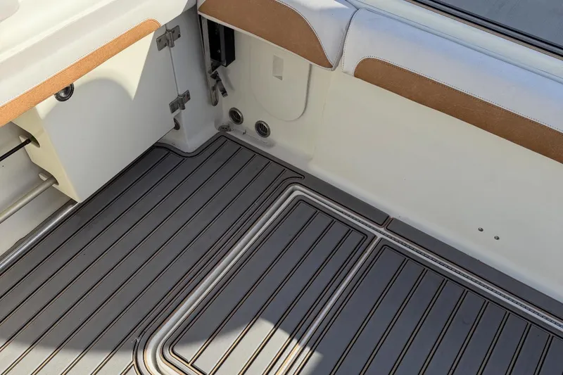 Slide: The Image of 2005 Hydra-Sports Vector 3300 VX boat interior with sleek, striped flooring and cushioned seating. - 6