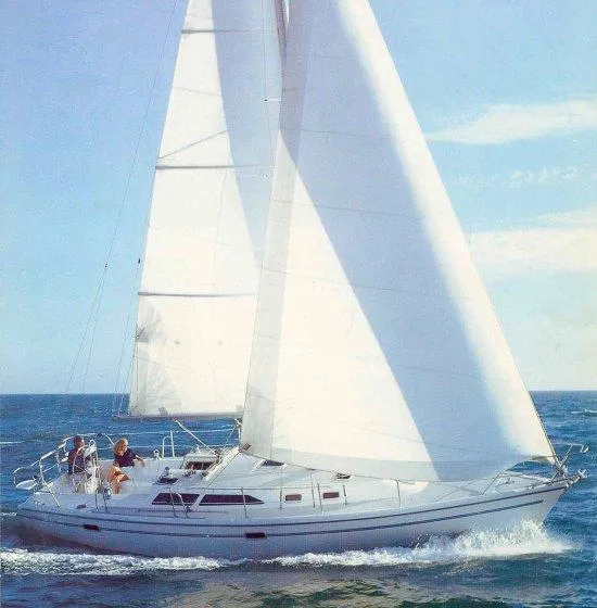 Slide: The Image of 1996 Catalina 36 MK 2 sailboat cruising on open sea under clear blue sky. - 4