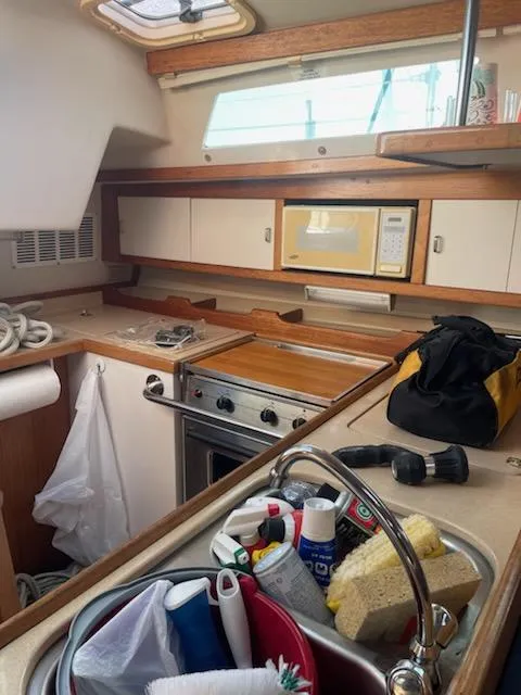 Slide: The Image of 1996 Catalina 36 MK 2 yacht kitchen with stove, sink, and storage. - 7
