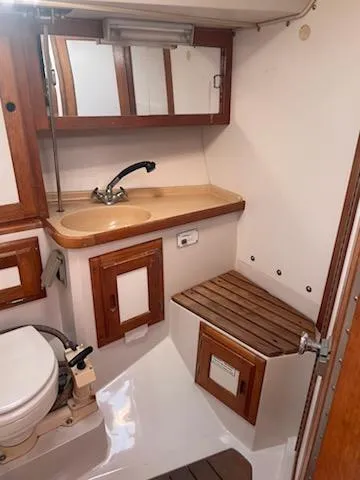 Slide: The Image of 1996 Catalina 36 MK 2 yacht bathroom with wooden cabinets and fixtures. - 9