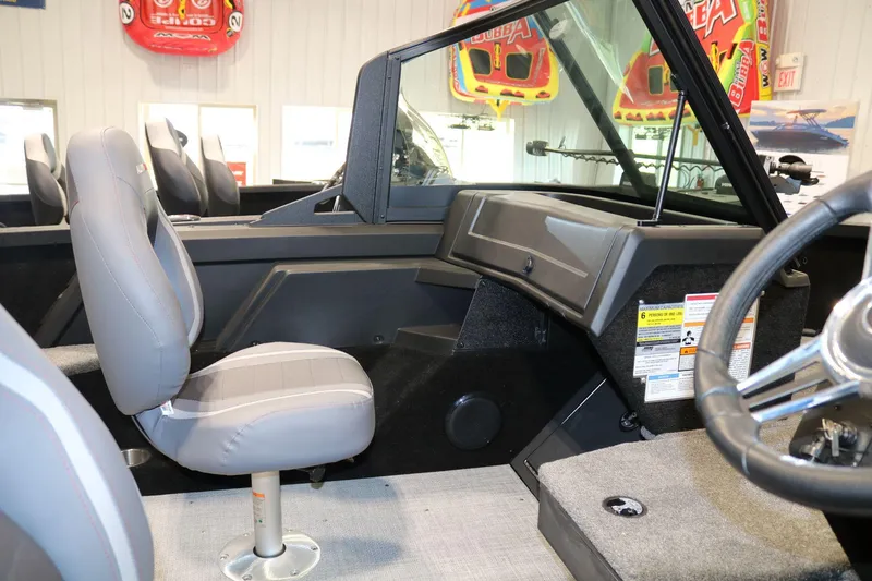 Slide: The Image of Interior of 2025 Alumacraft Competitor 175X Sport Rotax S boat, featuring seating and dashboard. - 11