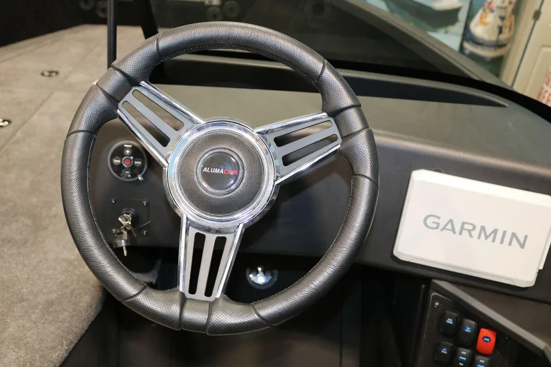 Slide: The Image of Steering wheel of 2025 Alumacraft Competitor 175X Sport Rotax S with Garmin display. - 15