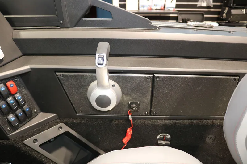 Slide: The Image of 2025 Alumacraft Competitor 175X Sport Rotax S boat control panel with throttle lever. - 17