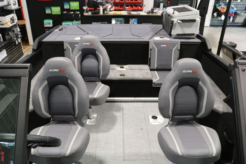 Slide: The Image of 2025 Alumacraft Competitor 175X Sport Rotax S interior with four gray seats. - 18
