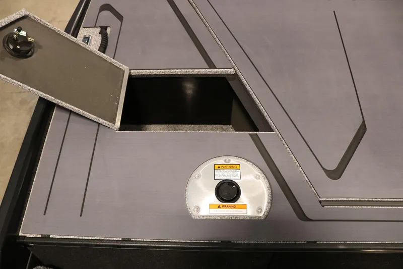 Slide: The Image of 2025 Alumacraft Competitor 175X Sport Rotax S boat storage compartment with open hatch. - 21