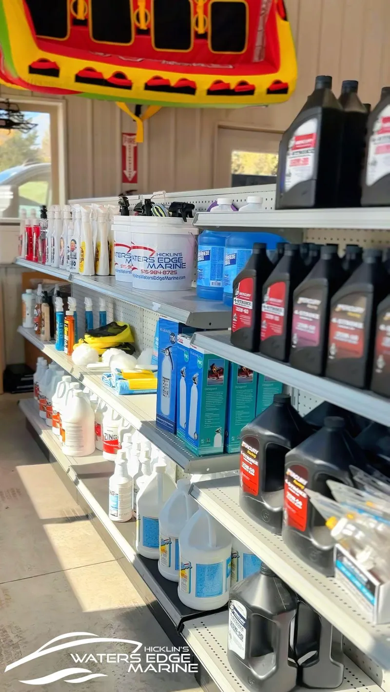 Slide: The Image of Boat maintenance products on shelves at a marine store, featuring Alumacraft Competitor 175X Sport Rotax S. - 24